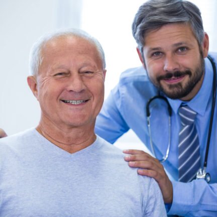 Portrait of a male doctor and patient at the hospital
